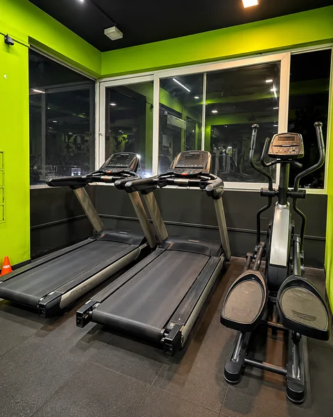Commercial motorized treadmills and elliptical cross trainer at Power House Gym Kolhapur