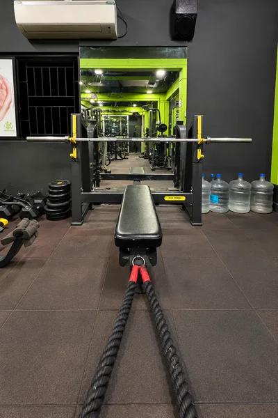 Viva Fitness Olympic flat bench press and battle ropes at Power House Gym